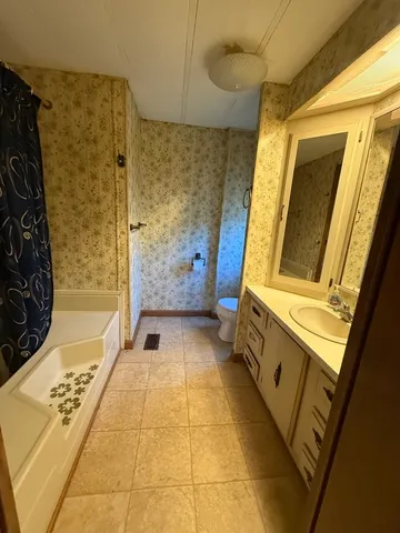 a bathroom with a bathtub and shower