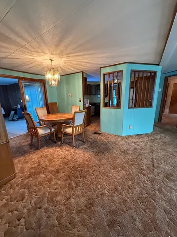 a view of a livingroom with furniture and window