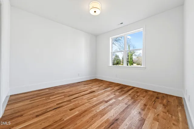 a white bath tub sitting in a bathroom next to a window