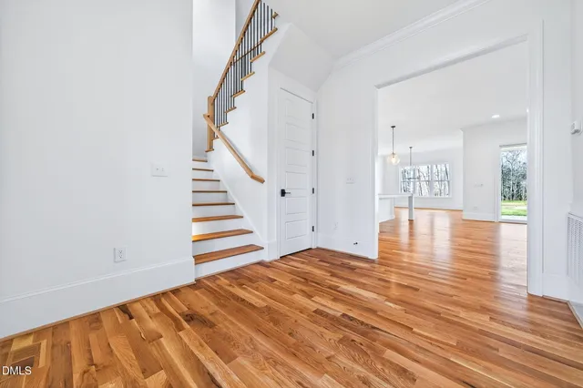 wooden floor in an empty room with a fireplace