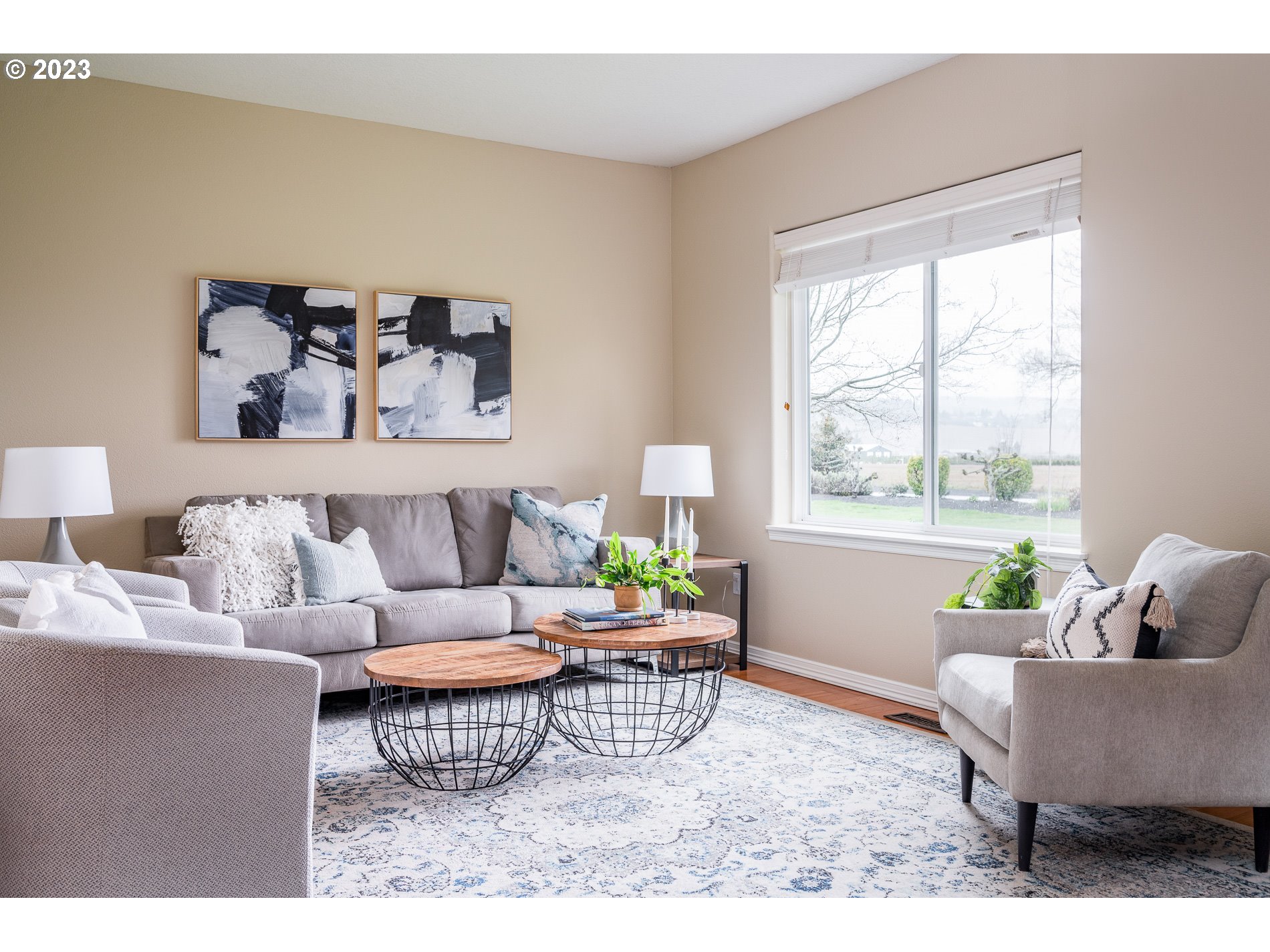 27730 Southwest Laurel Road Hillsboro, OR 97123 - Photo 14 of 32 a living room with furniture and a window