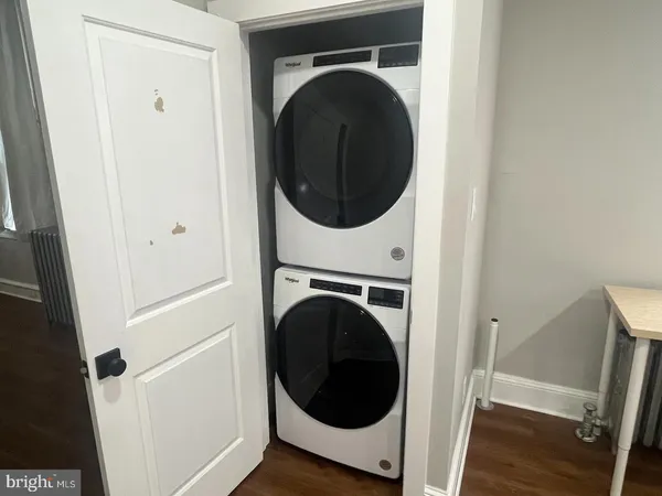 a view of a hallway with washer and dryer