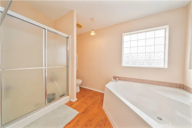 a bathroom with a bathtub and a shower