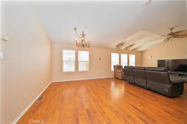 a view of a livingroom with wooden floor