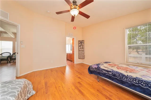 a bedroom with bed and window