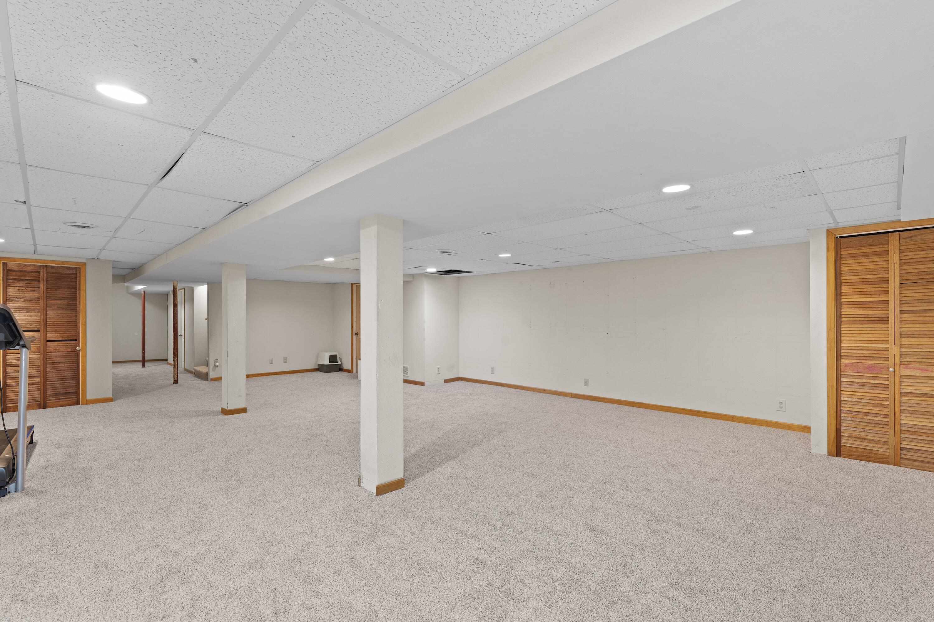N8093 Lakeview Road Oconomowoc, WI 53066 - Photo 28 of 44 Huge lower level rec room space with brand new carpet!