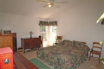 2701 Muir Mill Road Willits, CA 95490 - Photo 6 of 11 a bedroom with a bed and large windows