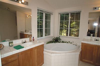 2701 Muir Mill Road Willits, CA 95490 - Photo 7 of 11 a bathroom with a granite countertop sink mirror and a bathtub