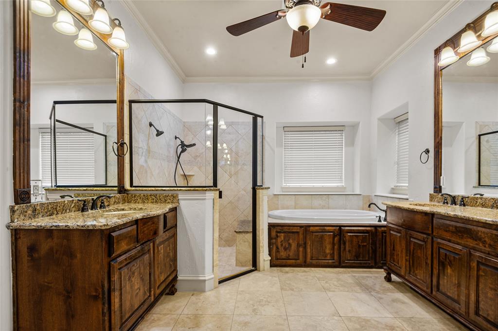 961 Deer Run Prosper, TX 75078 - Photo 19 of 34 a bathroom with a double vanity sink a mirror and a bathtub