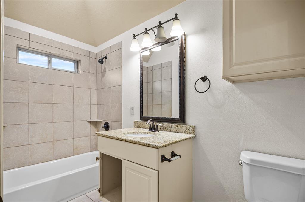 961 Deer Run Prosper, TX 75078 - Photo 26 of 34 a bathroom with a sink and a mirror