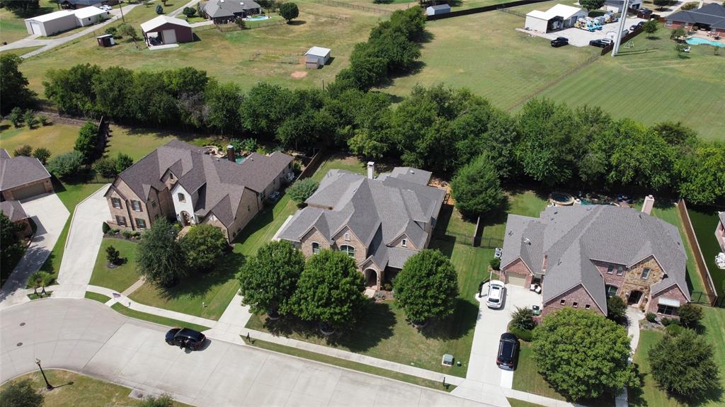 961 Deer Run Prosper, TX 75078 - Photo 30 of 34 an aerial view of residential house with outdoor space and lake view