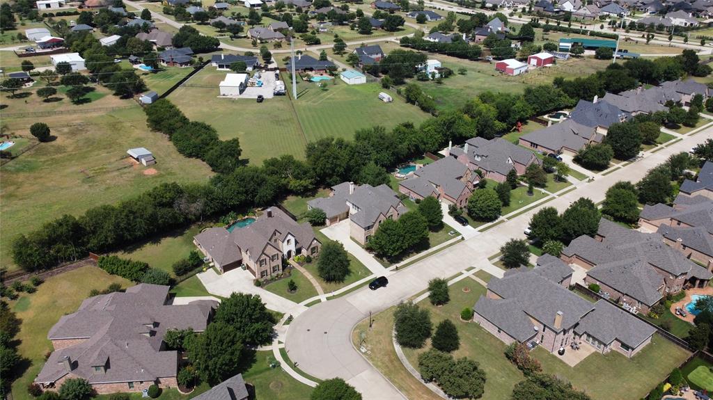 961 Deer Run Prosper, TX 75078 - Photo 32 of 34 an aerial view of residential houses with outdoor space