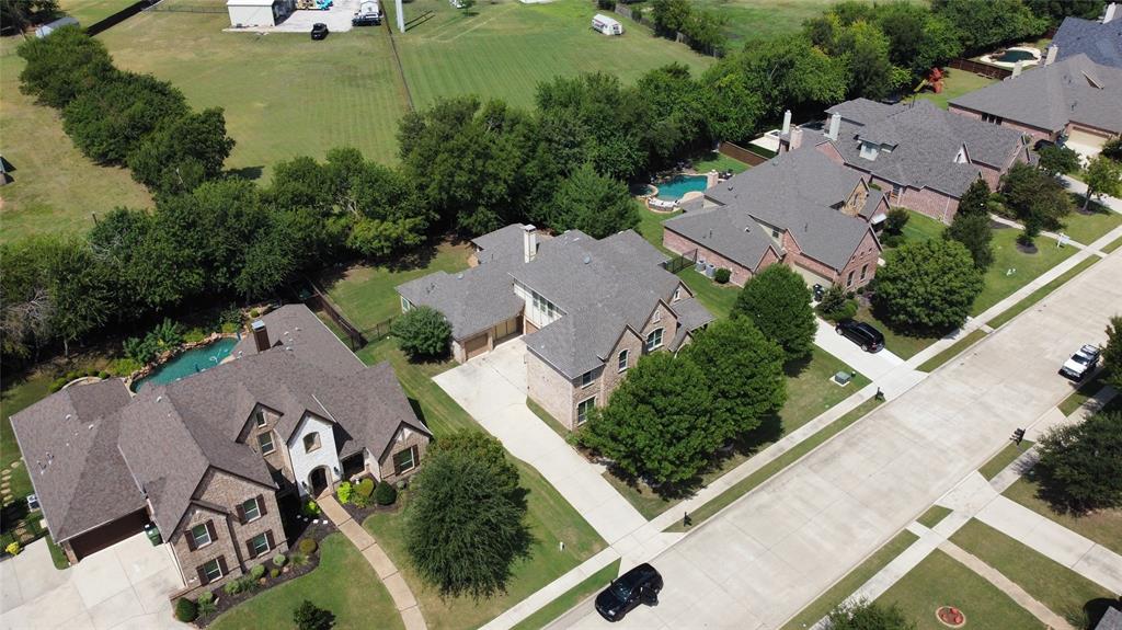 961 Deer Run Prosper, TX 75078 - Photo 34 of 34 an aerial view of residential house with outdoor space and lake view