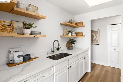 a bedroom with a bed and a potted plant