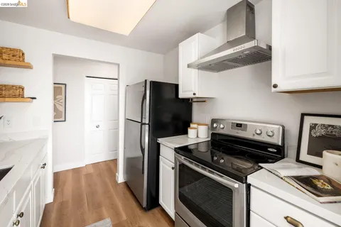 a bedroom with a bed and a lamp