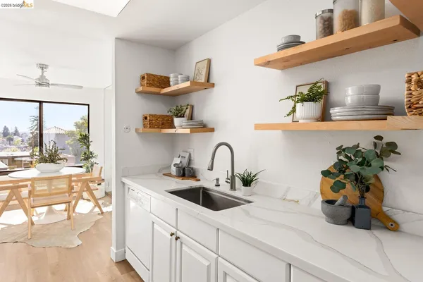 a bathroom with a sink vanity and a mirror