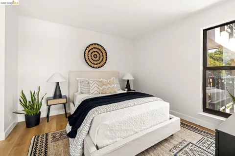 a bedroom with double bed and a large window