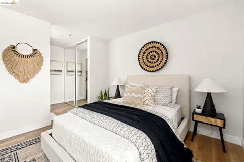 a bed room with a bed and a large window