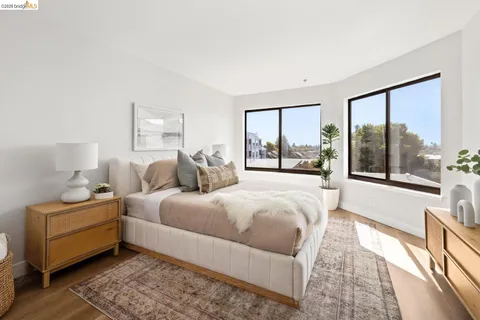 a bathroom with a sink vanity granite tub shower and mirror