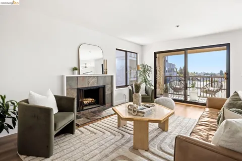 a view of a balcony with chair and potted plants