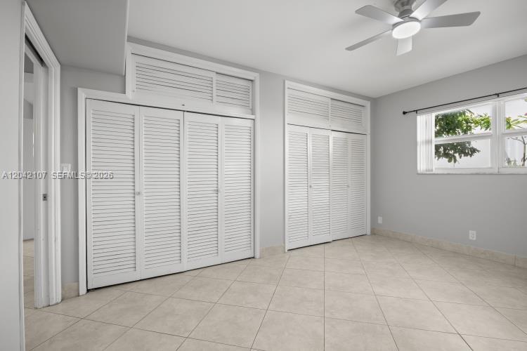 3213 Colony Club Road, Unit 3E Pompano Beach, FL 33062 - Photo 28 of 31 a view of an empty room with a window