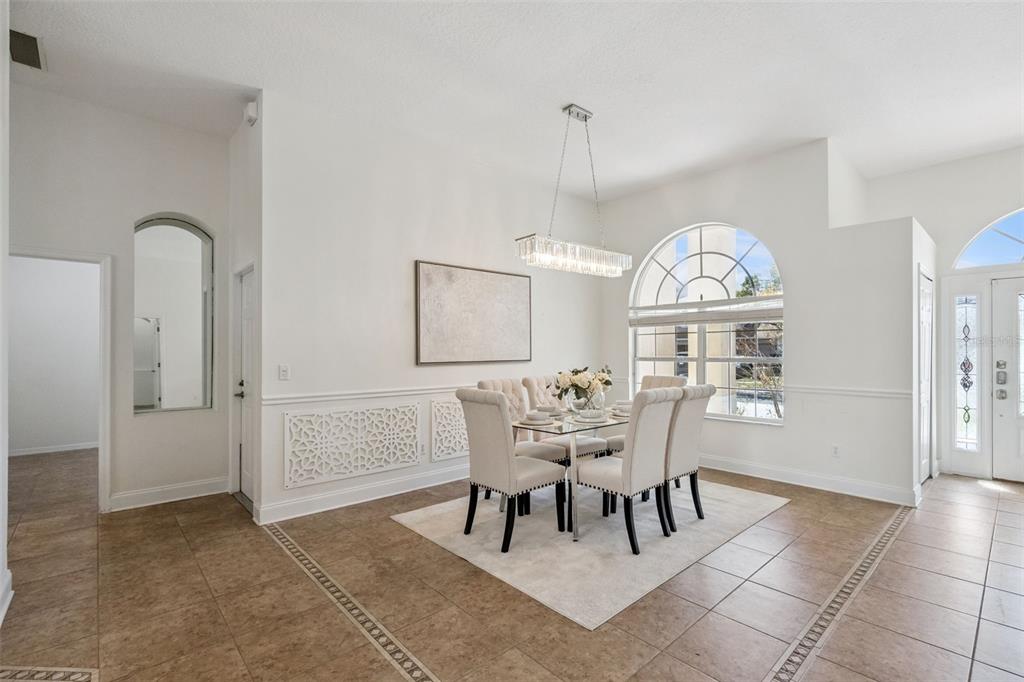 2541 Teton Stone Run Orlando, FL 32828 - Photo 22 of 82 a view of a dining room with furniture