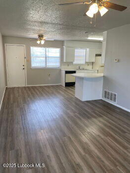 5309 22nd Street Lubbock, TX 79407 - Photo 3 of 13 a view of kitchen with granite countertop cabinets and window