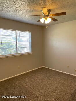 5309 22nd Street Lubbock, TX 79407 - Photo 6 of 13 an empty room with a window