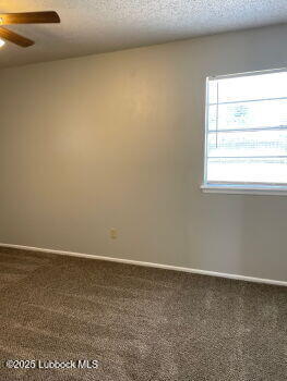5309 22nd Street Lubbock, TX 79407 - Photo 8 of 13 a view of an empty room and window