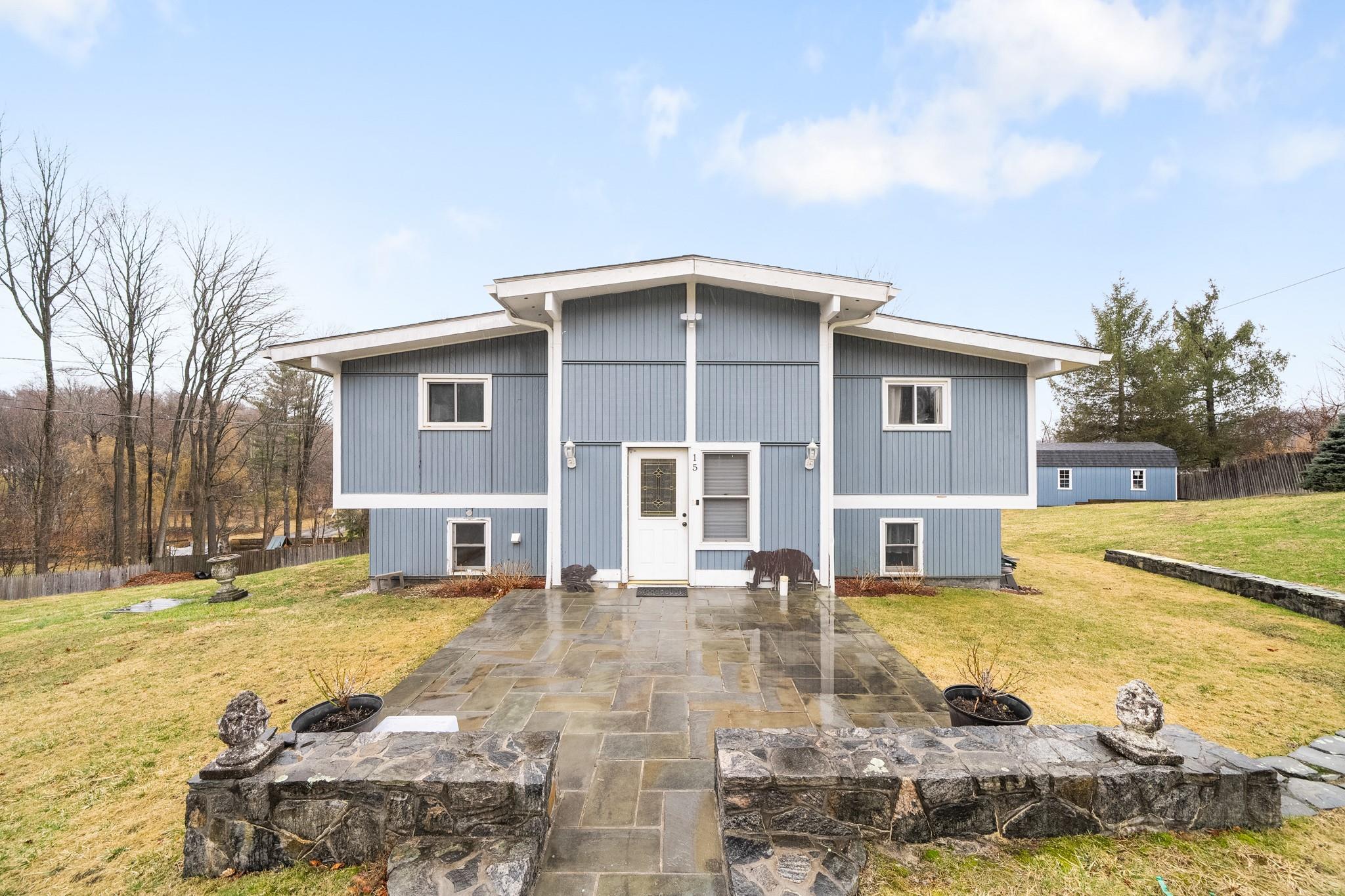 15 Meadowridge Road Brewster, NY 10509 - Photo 1 of 1 Back of house featuring fence, a yard, and a patio