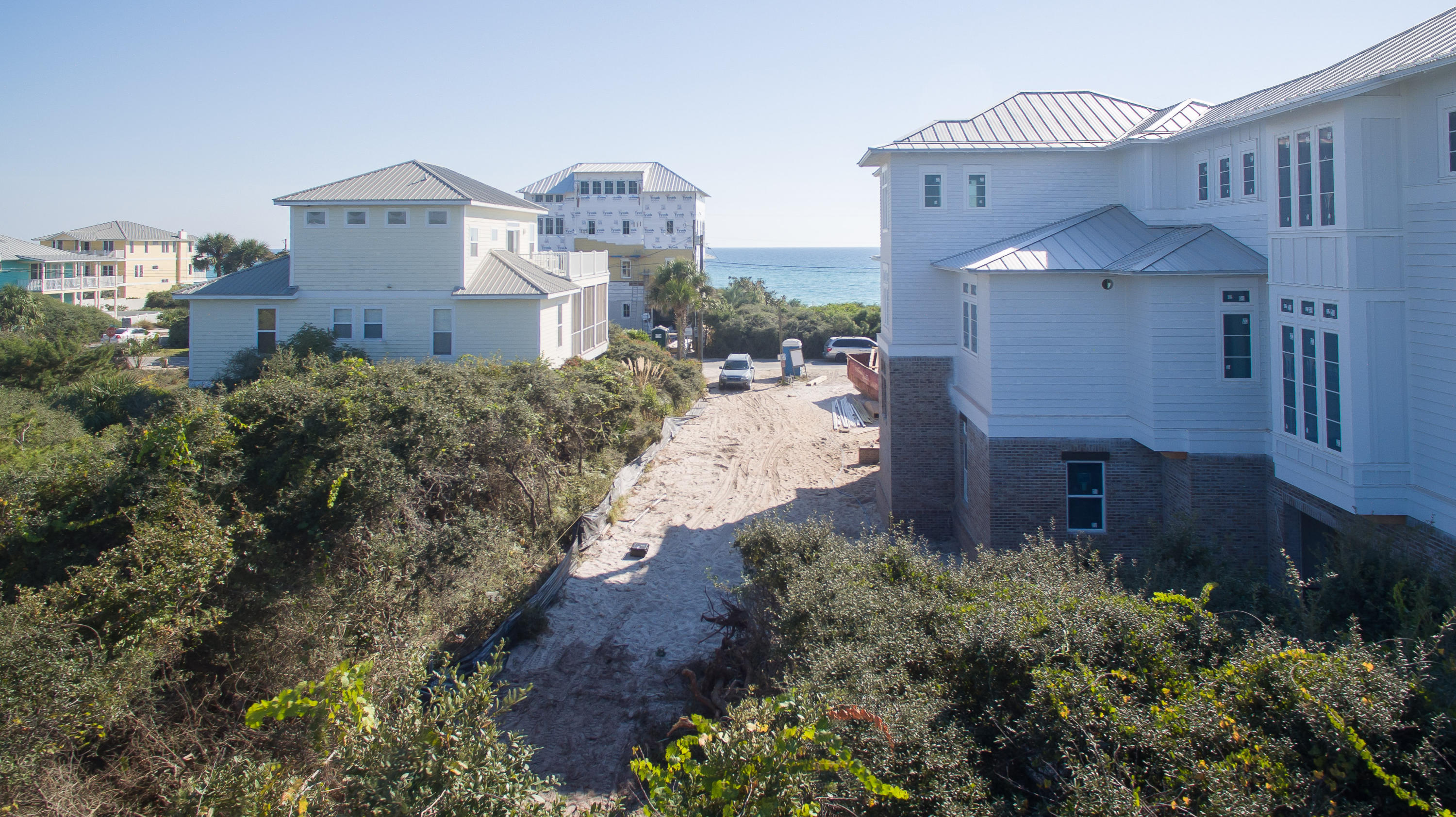 Lot 136 Pompano St Inlet Beach Inlet Beach, FL 32461 - Photo 8 of 17 a front view of a house with a yard and a fountain