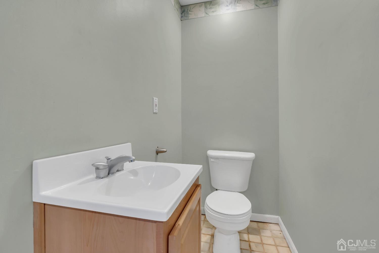 231 Station Road Monroe Township, NJ 08831 - Photo 11 of 36 a white toilet sitting next to a bathroom sink