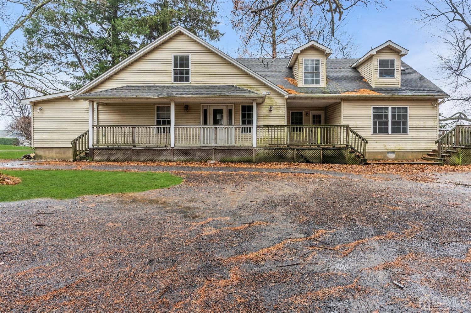 231 Station Road Monroe Township, NJ 08831 - Photo 2 of 36 a front view of a house with a yard and garage
