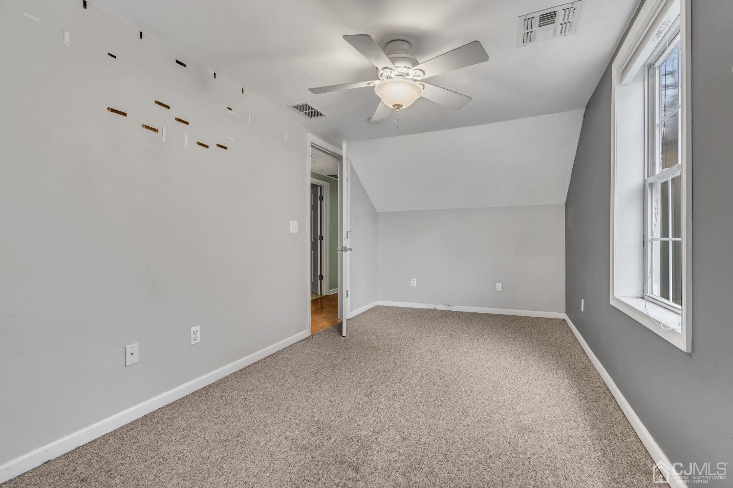 231 Station Road Monroe Township, NJ 08831 - Photo 22 of 36 a view of an empty room with a window
