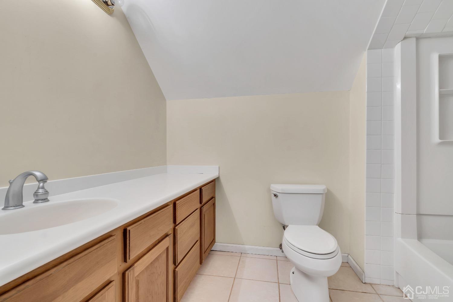 231 Station Road Monroe Township, NJ 08831 - Photo 24 of 36 a bathroom with a sink a toilet and a mirror