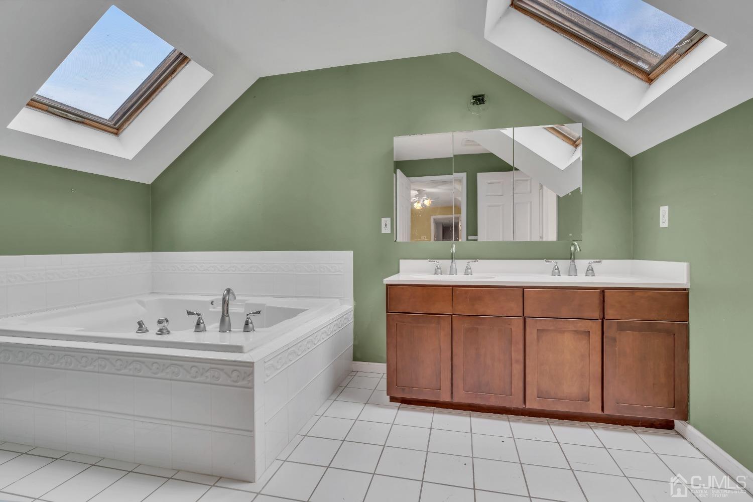 231 Station Road Monroe Township, NJ 08831 - Photo 28 of 36 a spacious bathroom with a double vanity sink mirror and bathtub
