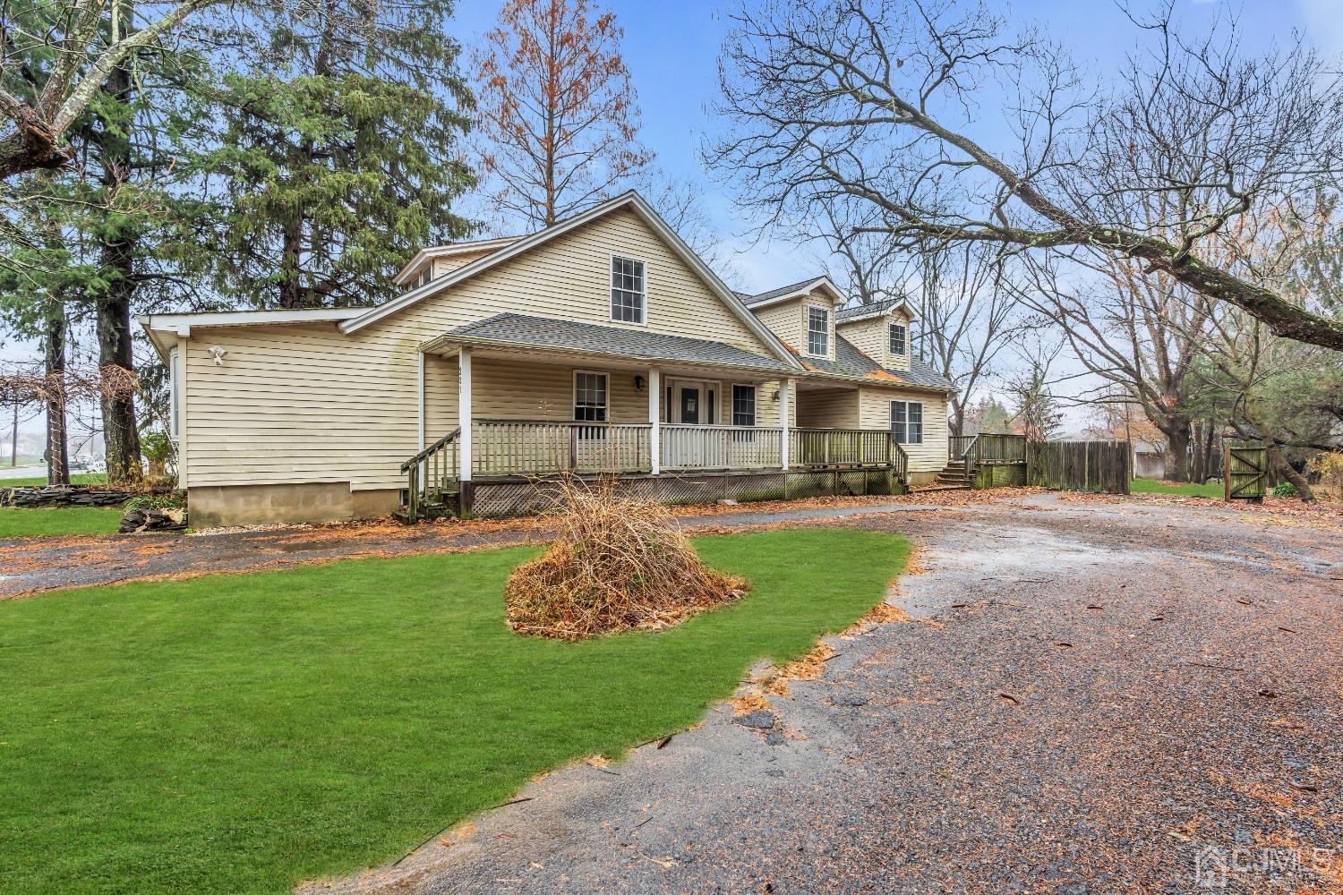 231 Station Road Monroe Township, NJ 08831 - Photo 3 of 36 a front view of house with yard and green space