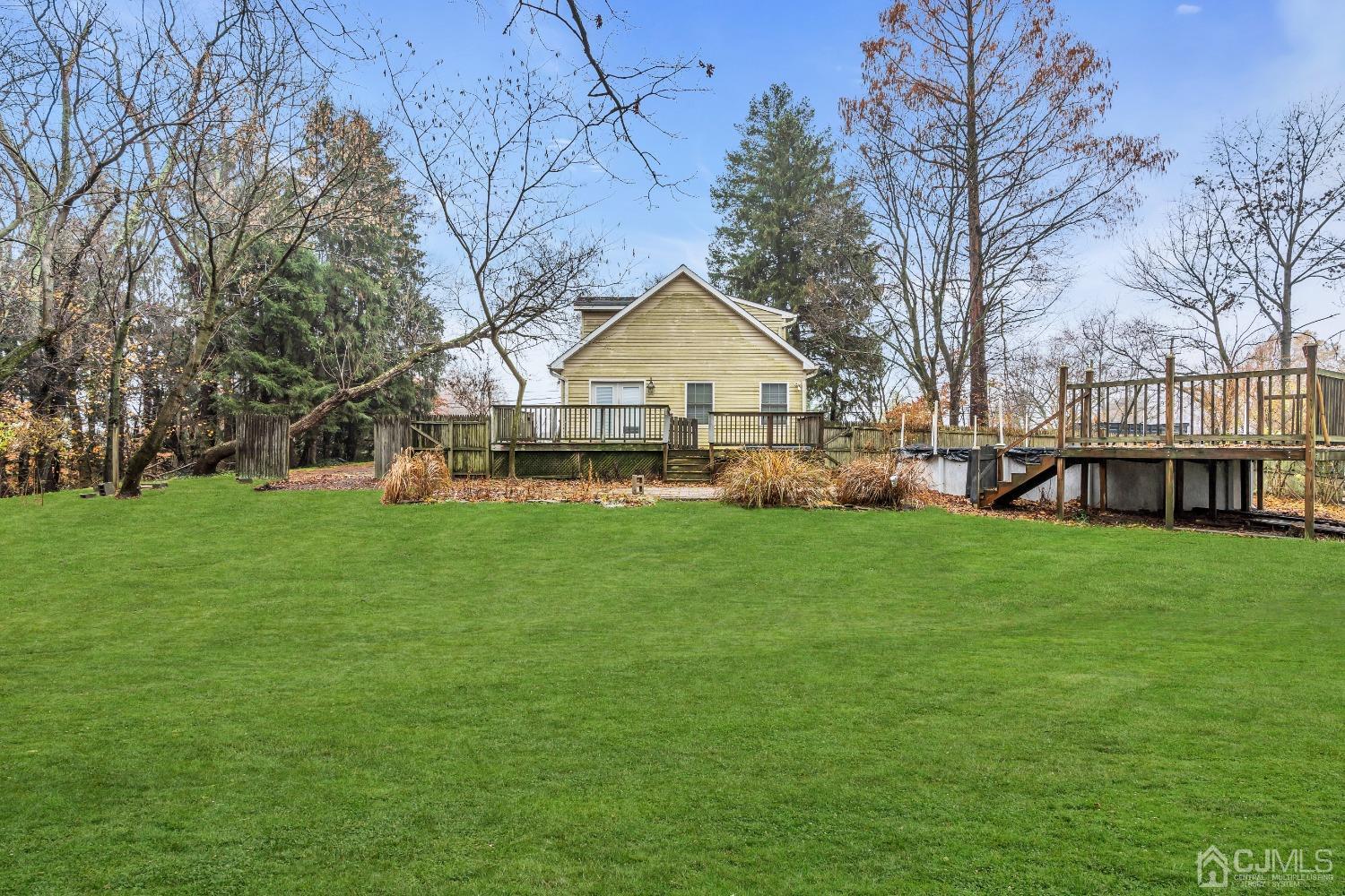 231 Station Road Monroe Township, NJ 08831 - Photo 36 of 36 a front view of a house with a yard and trees