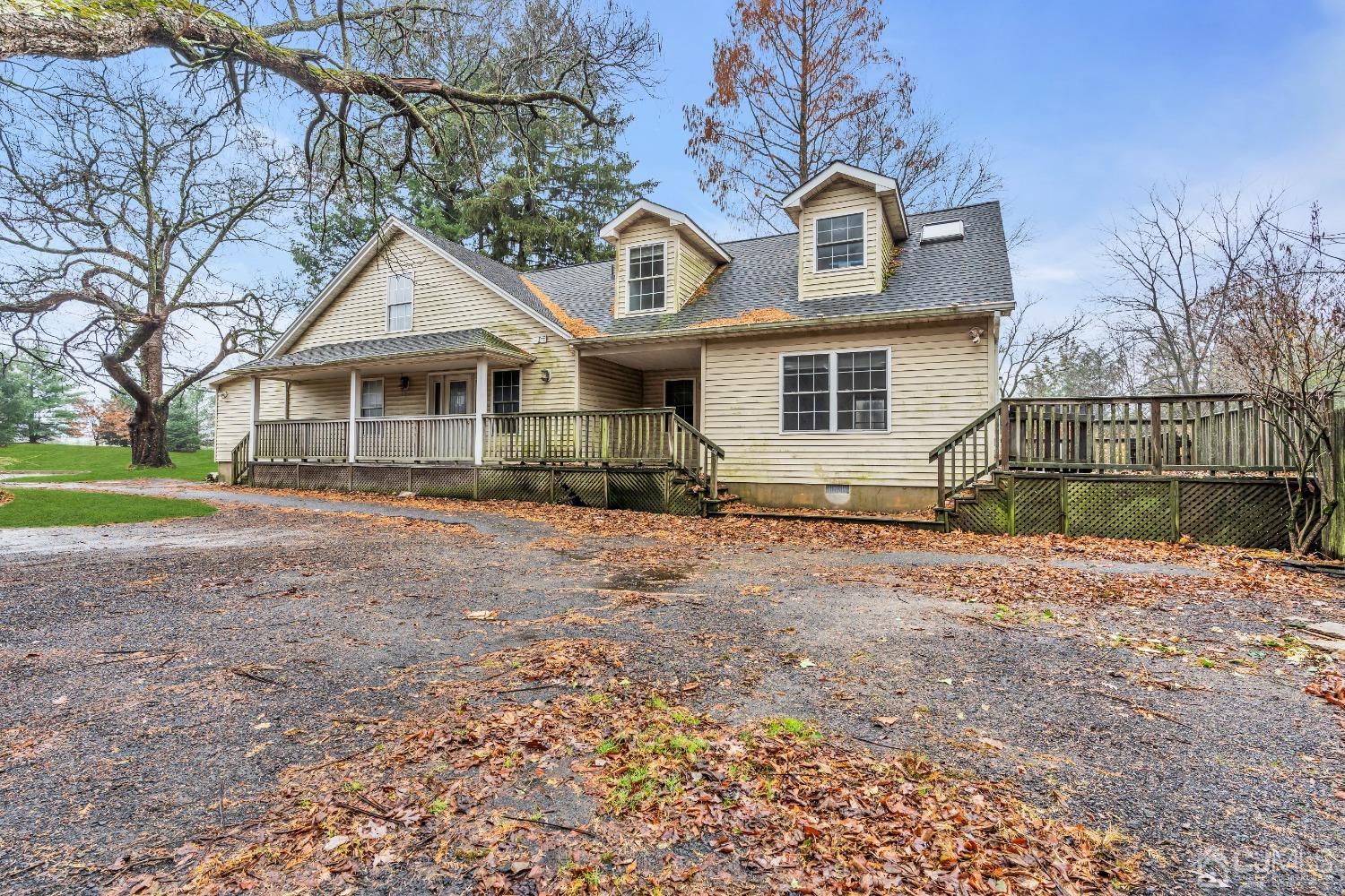 231 Station Road Monroe Township, NJ 08831 - Photo 4 of 36 a front view of a house with a yard
