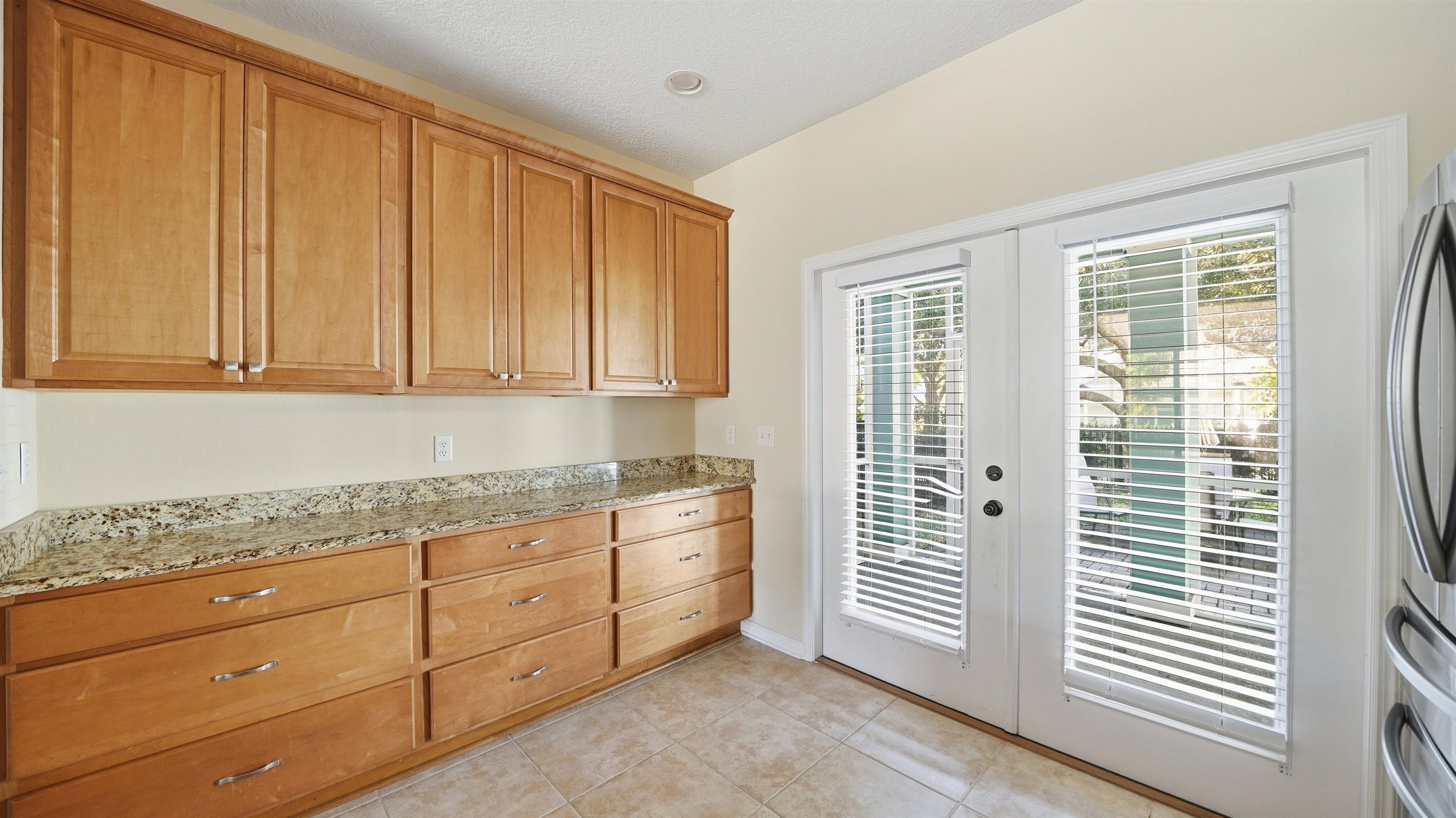 1121 Overdale Road St. Augustine, FL 32080 - Photo 12 of 65 a kitchen with granite countertop cabinets and window