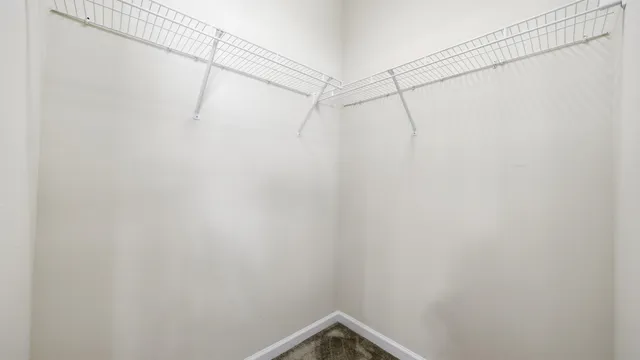 a view of a chair and table in backyard of the house