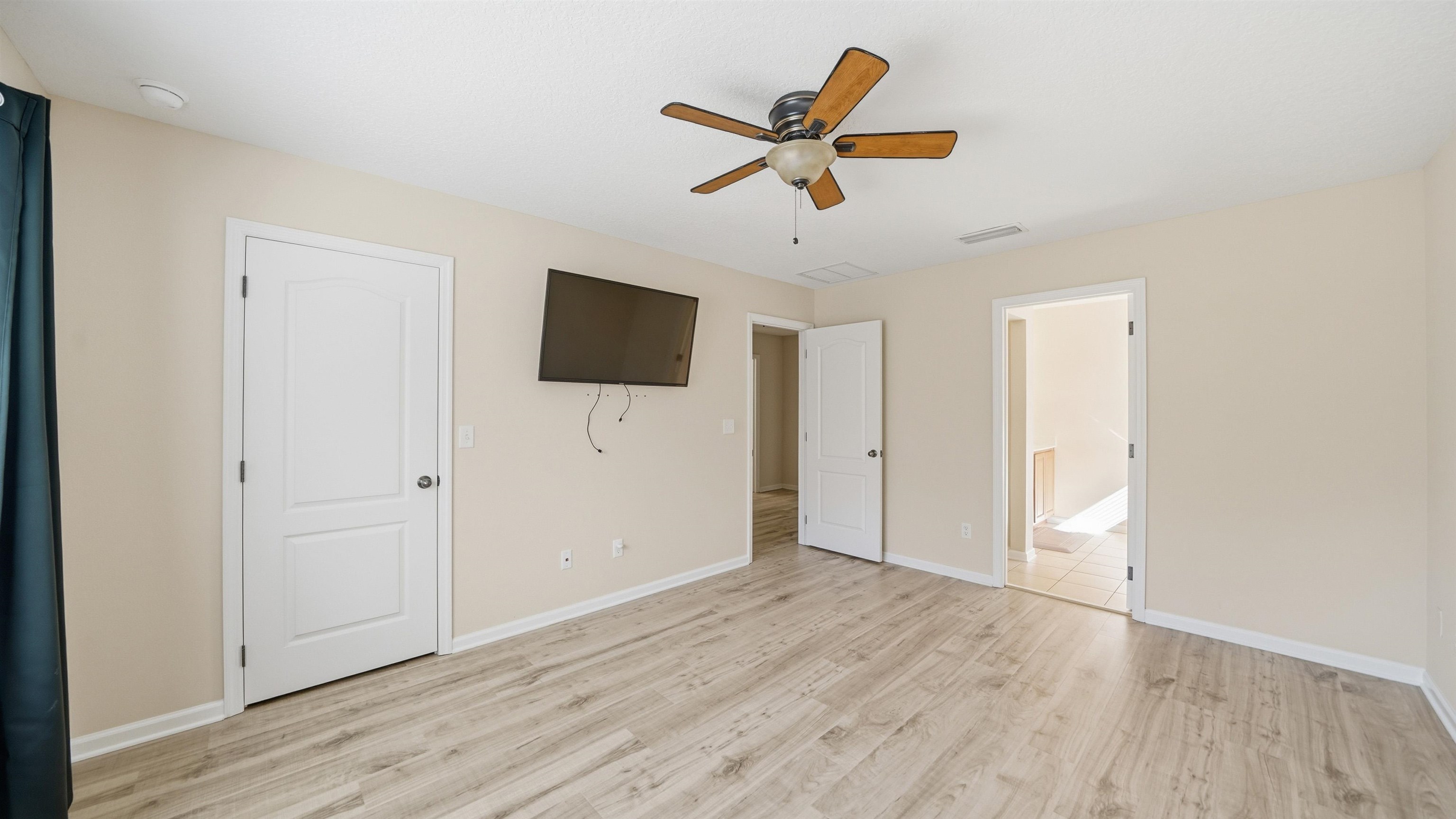 1121 Overdale Road St. Augustine, FL 32080 - Photo 26 of 65 Unfurnished bedroom featuring a ceiling fan and light wood-type flooring