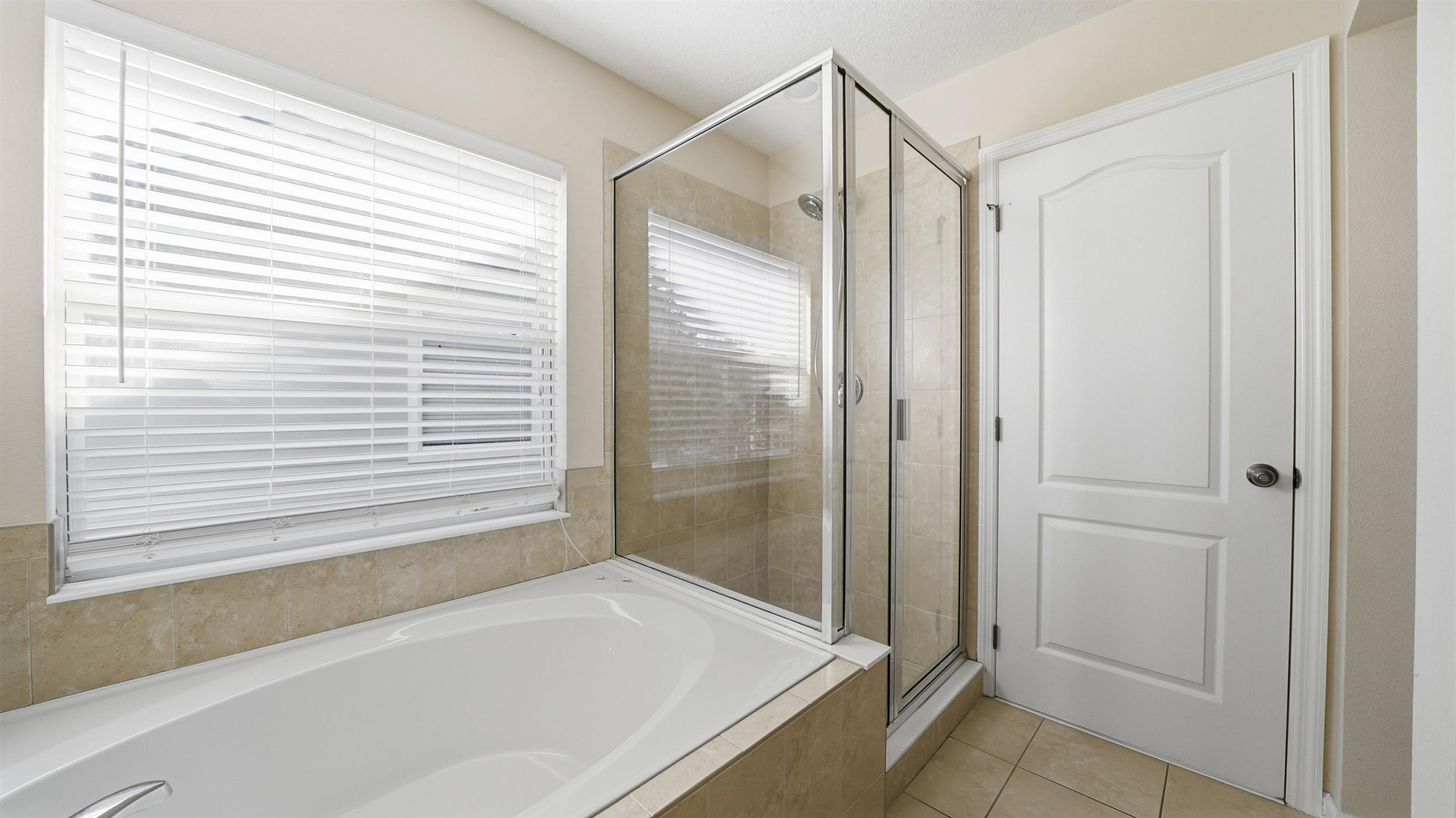 1121 Overdale Road St. Augustine, FL 32080 - Photo 30 of 65 Full bathroom with a bath, light tile patterned floors, and a shower stall