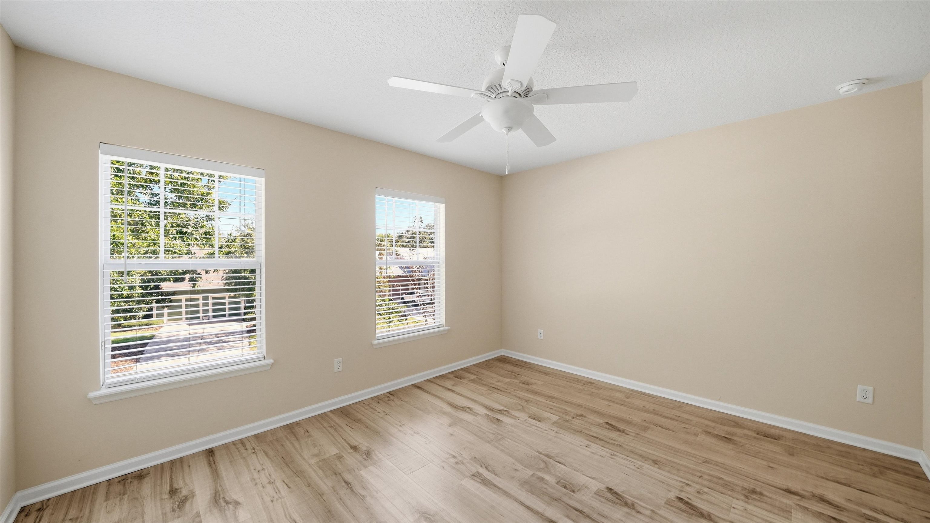 1121 Overdale Road St. Augustine, FL 32080 - Photo 31 of 65 a view of an empty room with wooden floor and a window