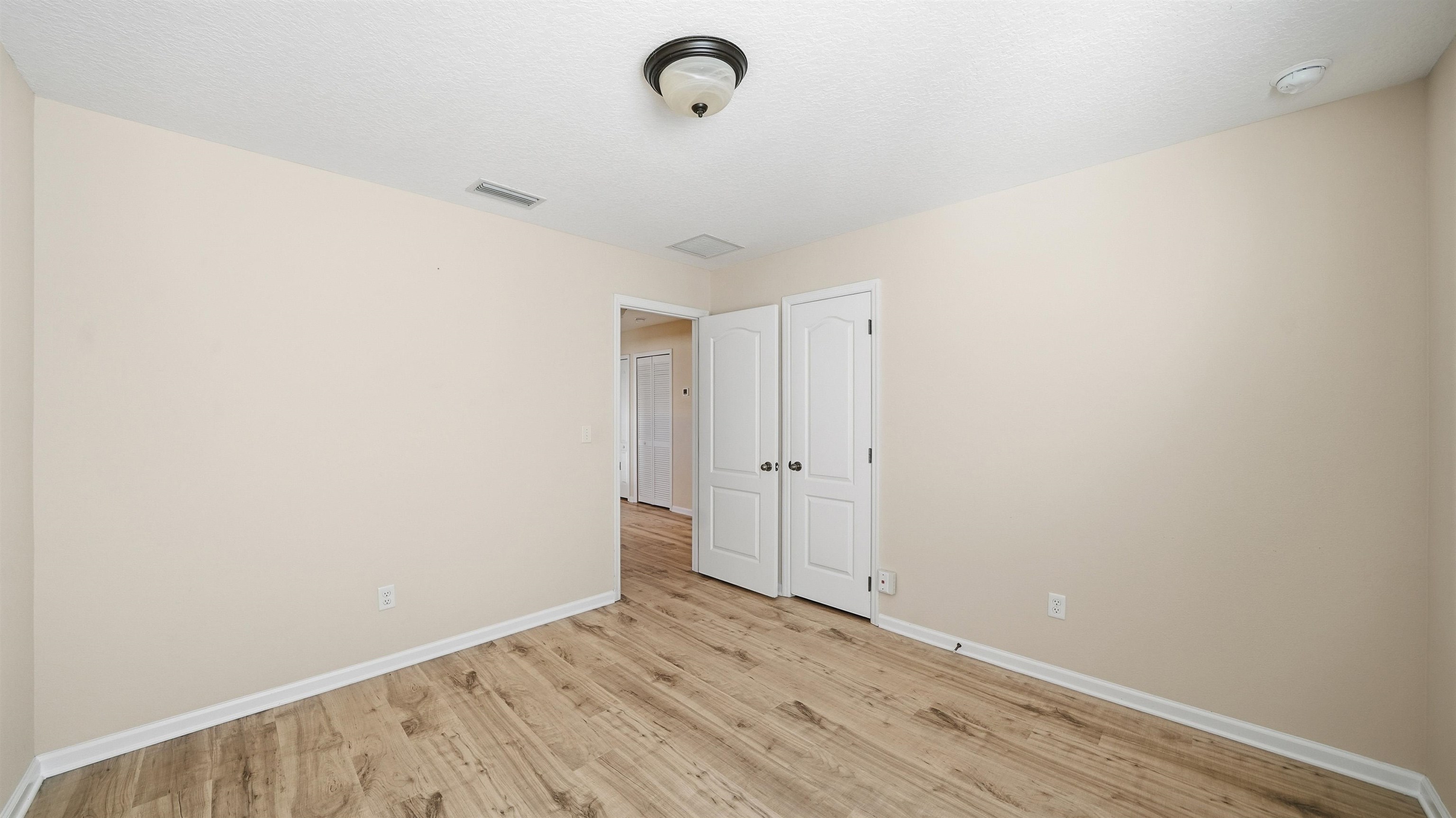 1121 Overdale Road St. Augustine, FL 32080 - Photo 36 of 65 a view of a room with wooden floor