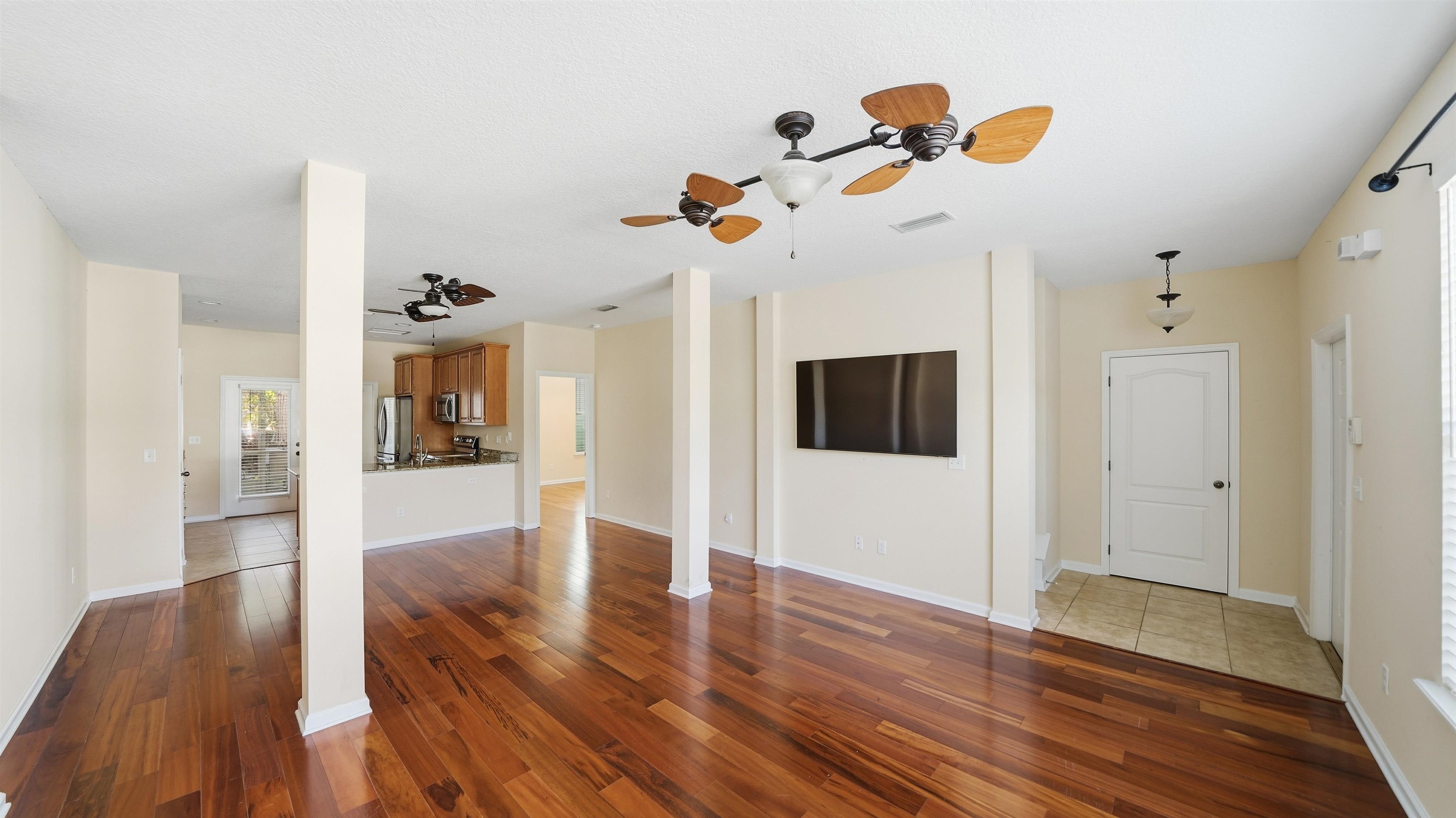 1121 Overdale Road St. Augustine, FL 32080 - Photo 4 of 65 Unfurnished living room featuring dark wood finished floors and ceiling fan