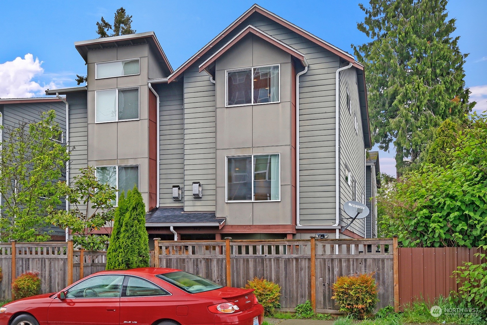 952 North 96th Street Seattle, WA 98103 - Photo 1 of 1 a front view of house with yard and trees in the background