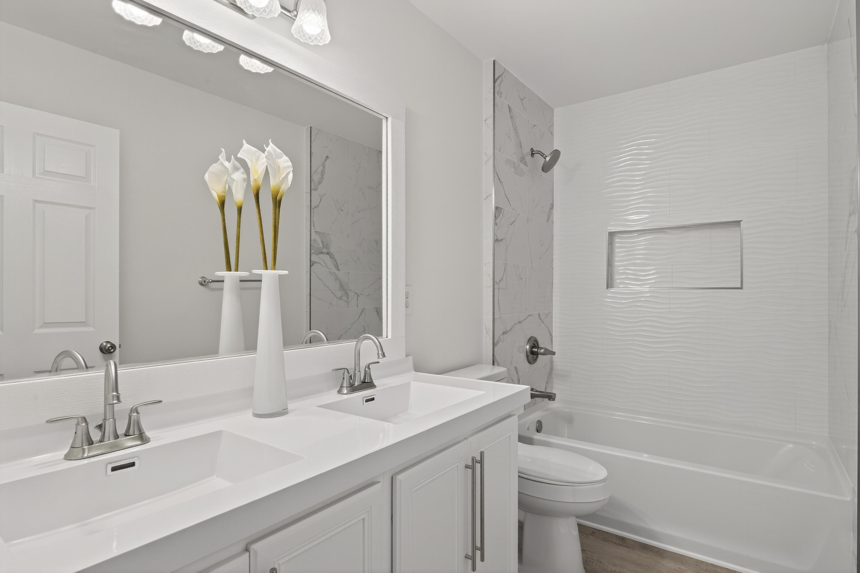 151 Beacon Way Miramar Beach, FL 32550 - Photo 12 of 42 a bathroom with a double vanity sink toilet and shower