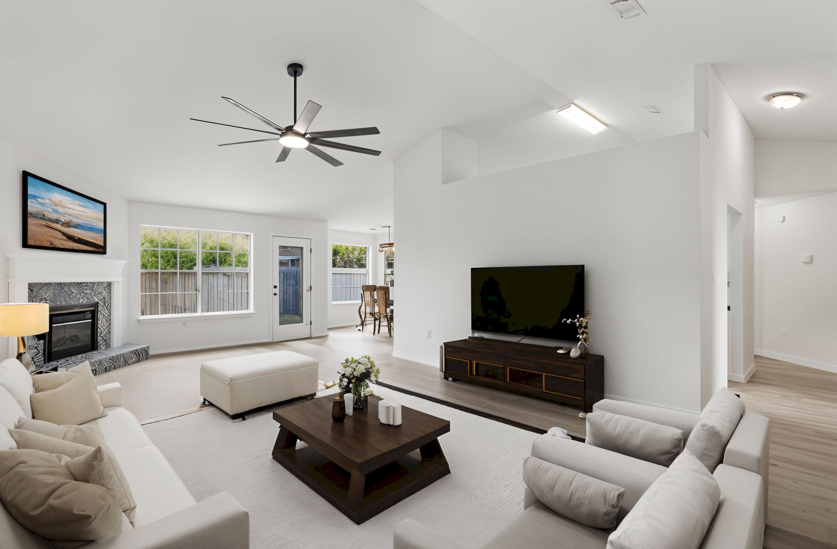 151 Beacon Way Miramar Beach, FL 32550 - Photo 14 of 42 a living room with furniture a fireplace and a flat screen tv
