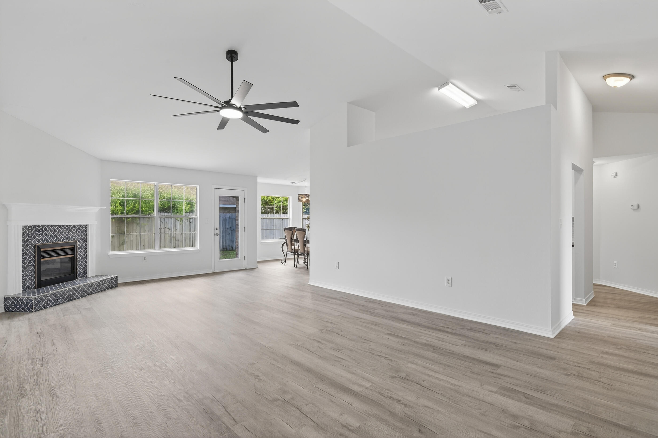 151 Beacon Way Miramar Beach, FL 32550 - Photo 15 of 42 a view of an empty room with a window and a kitchen